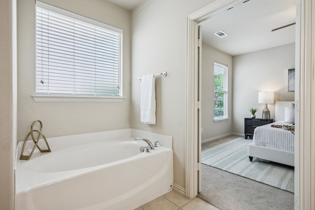 8100 Delaware Dr, Mckinney, TX 75070 - ensuite bathroom with a bath, tile patterned floors, and baseboards