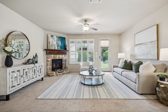 8100 Delaware Dr, Mckinney, TX 75070 - carpeted living area featuring a ceiling fan and a stone fireplace