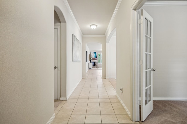 8100 Delaware Dr, Mckinney, TX 75070 - corridor with arched walkways, crown molding, light tile patterned flooring, and baseboards