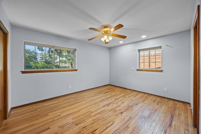 3212 Medina Ave, Fort Worth, TX 76133 - unfurnished bedroom featuring multiple windows, hardwood / wood-style floors, a closet, recessed lighting, and baseboards