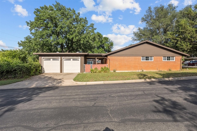 3212 Medina Ave, Fort Worth, TX 76133 - ranch-style house featuring a garage, concrete driveway, and brick siding