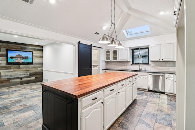 1510 Waltham Ct, Arlington, TX 76012 - kitchen with wood counters, dishwasher, washer / clothes dryer, a skylight, and dark stone finish flooring