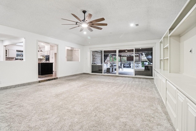 1510 Waltham Ct, Arlington, TX 76012 - unfurnished living room featuring ceiling fan, carpet floors, and a textured ceiling
