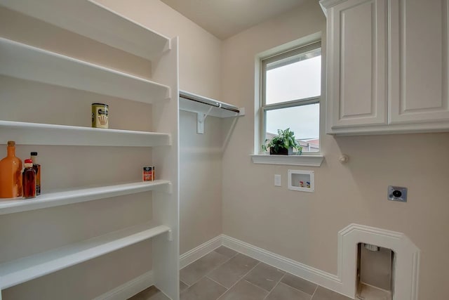 7514 Harbor Dr, Rowlett, TX 75088 - washroom with hookup for an electric dryer, hookup for a washing machine, cabinet space, and tile patterned flooring