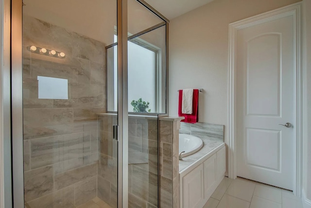 7514 Harbor Dr, Rowlett, TX 75088 - bathroom with a bath, a stall shower, and tile patterned flooring