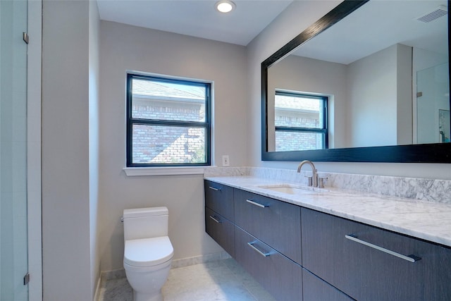 3710 Binkley Ave, University Park, TX 75205 - full bathroom featuring vanity, baseboards, toilet, a shower with shower door, and tile patterned floors