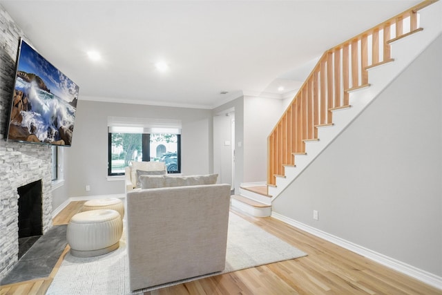 3710 Binkley Ave, University Park, TX 75205 - living area featuring wood finished floors, stairway, crown molding, a stone fireplace, and baseboards