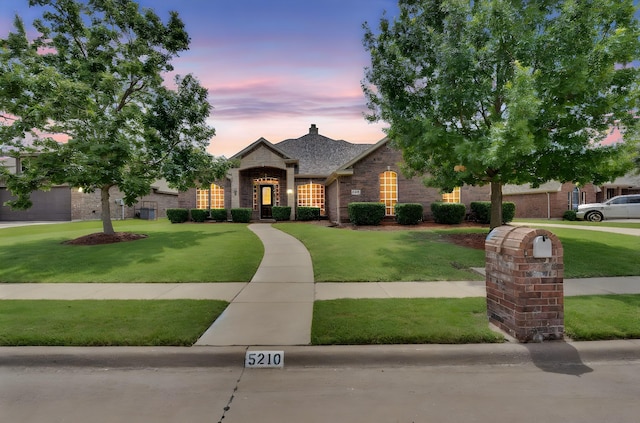 5210 Medallion Ct, Midlothian, TX 76065 - french country style house with a front yard and brick siding