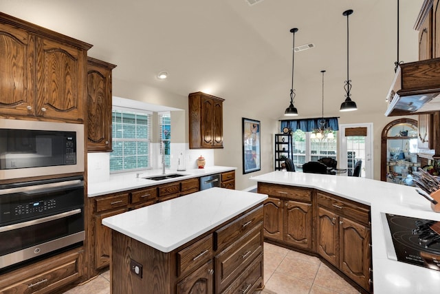 5210 Medallion Ct, Midlothian, TX 76065 - kitchen with stainless steel appliances, a sink, a kitchen island, light countertops, and light tile patterned floors