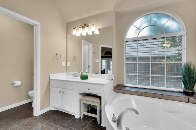 5210 Medallion Ct, Midlothian, TX 76065 - bathroom with a garden tub, vanity, toilet, tile patterned floors, and lofted ceiling