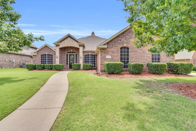 5210 Medallion Ct, Midlothian, TX 76065 - french country home with brick siding, a front yard, and roof with shingles
