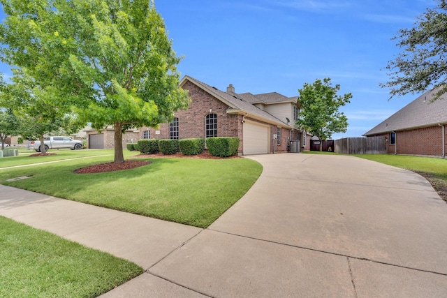 5210 Medallion Ct, Midlothian, TX 76065 - view of front facade with brick siding, driveway, an attached garage, and a chimney