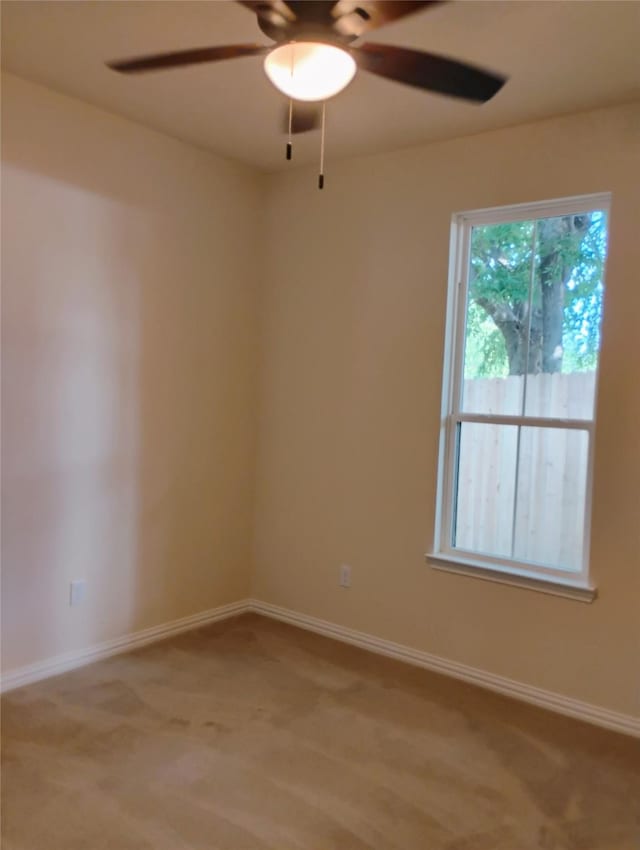 901 SW 10th St, Mineral Wells, TX 76067 - empty room with a ceiling fan, baseboards, and light colored carpet