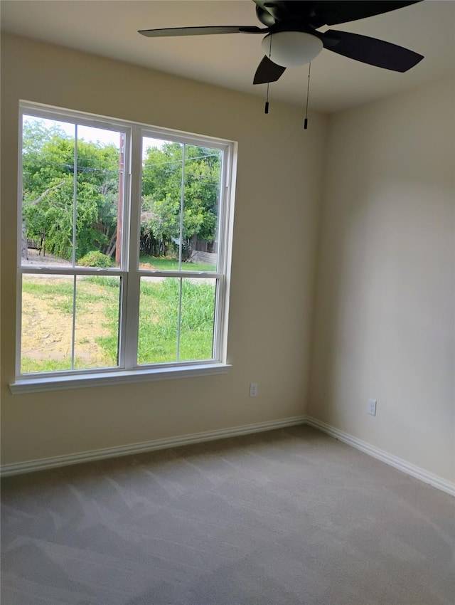901 SW 10th St, Mineral Wells, TX 76067 - spare room featuring a ceiling fan, carpet, healthy amount of natural light, and baseboards
