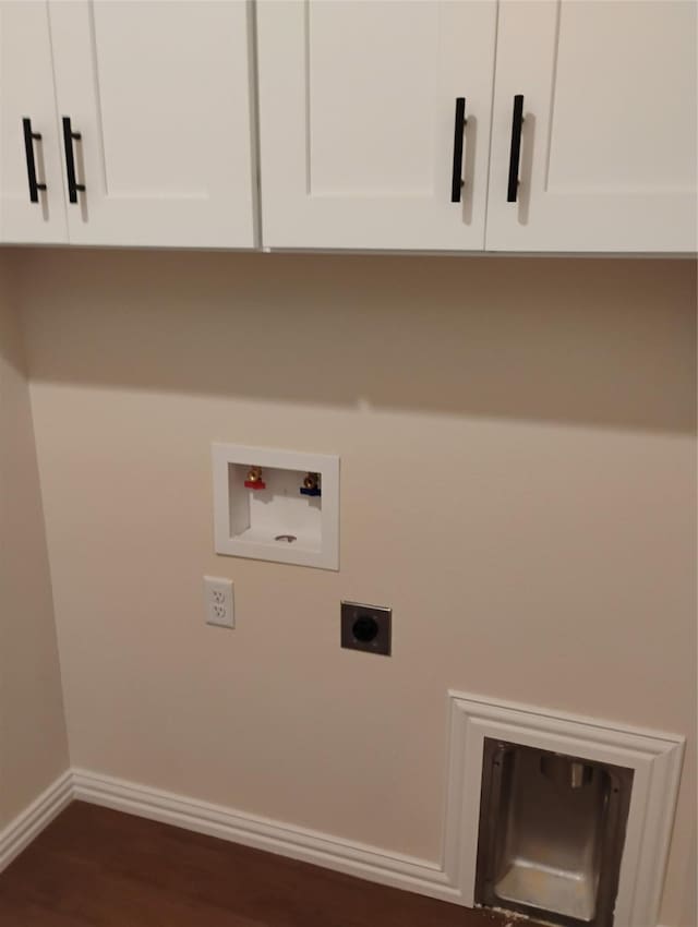 901 SW 10th St, Mineral Wells, TX 76067 - laundry room with electric dryer hookup, cabinet space, washer hookup, baseboards, and dark wood finished floors