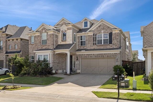 1305 Mary Horn Ln, Aubrey, TX 76227 - view of front of house with concrete driveway, an attached garage, and brick siding