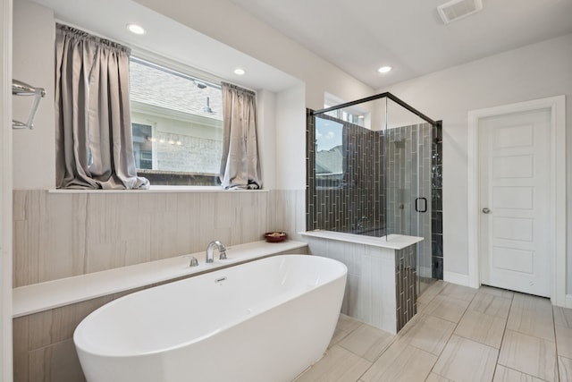 1305 Mary Horn Ln, Aubrey, TX 76227 - bathroom with a freestanding tub, a stall shower, and recessed lighting