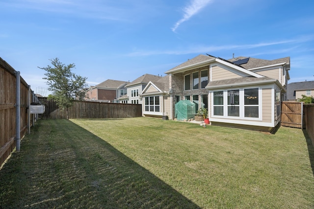 1305 Mary Horn Ln, Aubrey, TX 76227 - back of property with a shingled roof and solar panels