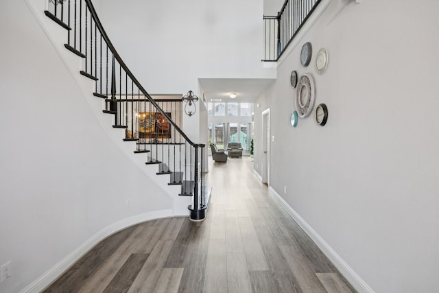 1305 Mary Horn Ln, Aubrey, TX 76227 - foyer entrance featuring wood finished floors, stairway, a high ceiling, and baseboards