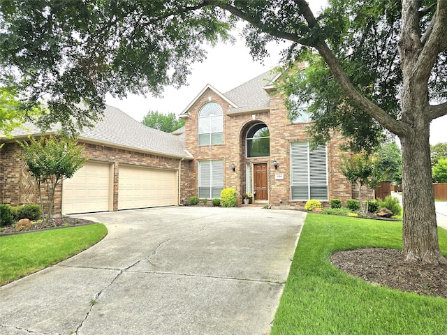 1504 Blossom Ct, Allen, TX 75013 - traditional home featuring brick siding, a shingled roof, concrete driveway, and a garage