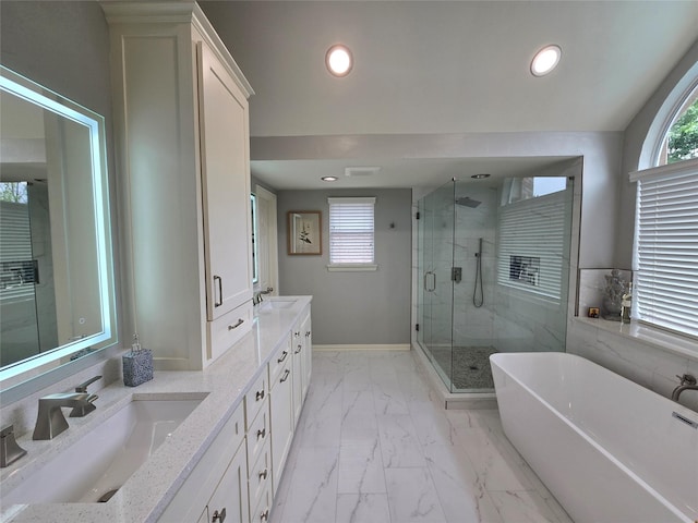 1504 Blossom Ct, Allen, TX 75013 - full bath with double vanity, a shower stall, a freestanding bath, marble look tiles, and recessed lighting