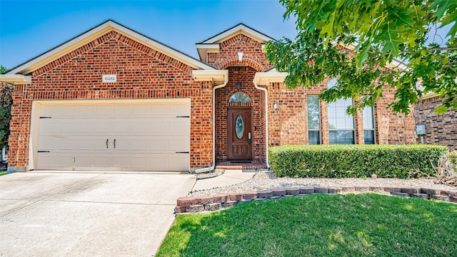 10252 Los Barros Trl, Fort Worth, TX 76177 - traditional-style house featuring brick siding, an attached garage, concrete driveway, and a front yard