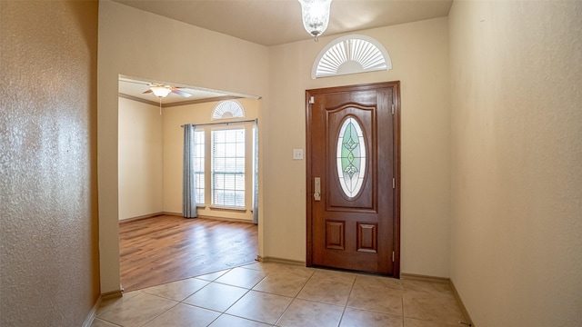 10252 Los Barros Trl, Fort Worth, TX 76177 - foyer with a ceiling fan, light tile patterned floors, and baseboards
