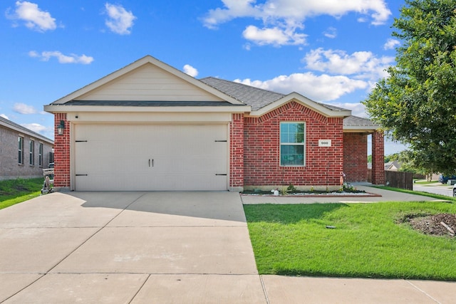 900 Sapphire Dr, Princeton, TX 75407 - ranch-style house featuring a garage, driveway, a front yard, brick siding, and a shingled roof