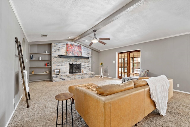 2801 Good Shepherd Dr, Brownwood, TX 76801 - living room with carpet flooring, ceiling fan, a textured ceiling, baseboards, and built in features