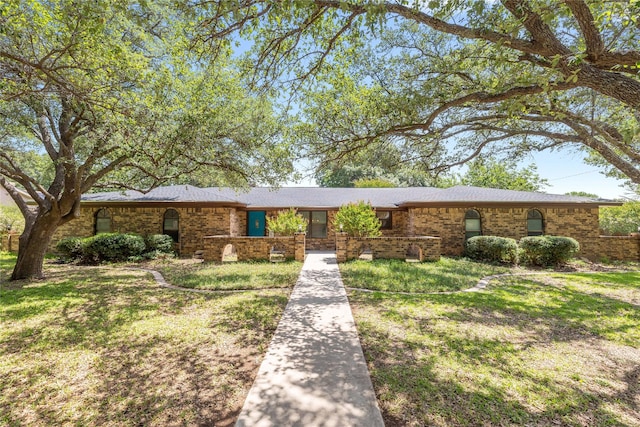 2801 Good Shepherd Dr, Brownwood, TX 76801 - ranch-style house featuring brick siding and a front lawn