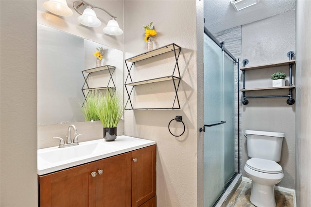 2801 Good Shepherd Dr, Brownwood, TX 76801 - full bathroom with vanity, a textured wall, toilet, and a stall shower