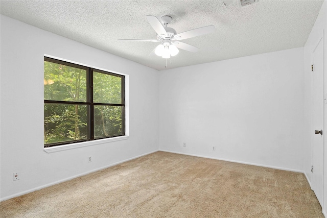 2801 Good Shepherd Dr, Brownwood, TX 76801 - unfurnished room featuring light colored carpet, ceiling fan, a textured ceiling, and baseboards