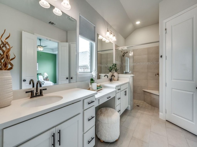 7621 Newtown, The Colony, TX 75056 - ensuite bathroom featuring vanity, tiled shower, a ceiling fan, and tile patterned flooring