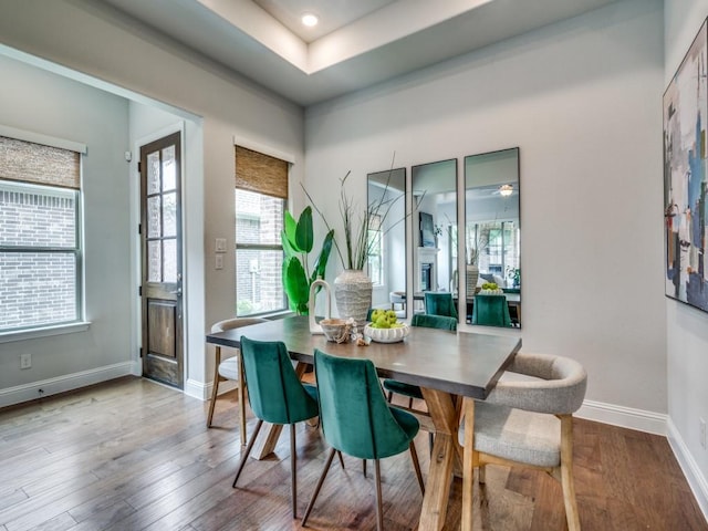 7621 Newtown, The Colony, TX 75056 - dining space featuring plenty of natural light and wood finished floors