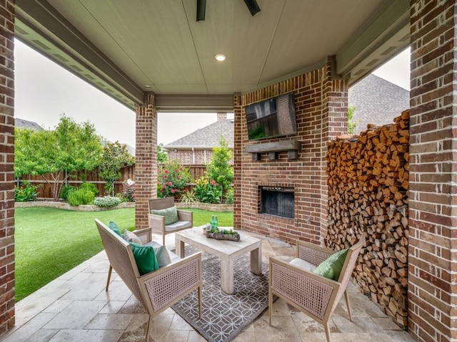 7621 Newtown, The Colony, TX 75056 - fenced backyard with a patio area, an outdoor living space with a fireplace, and ceiling fan