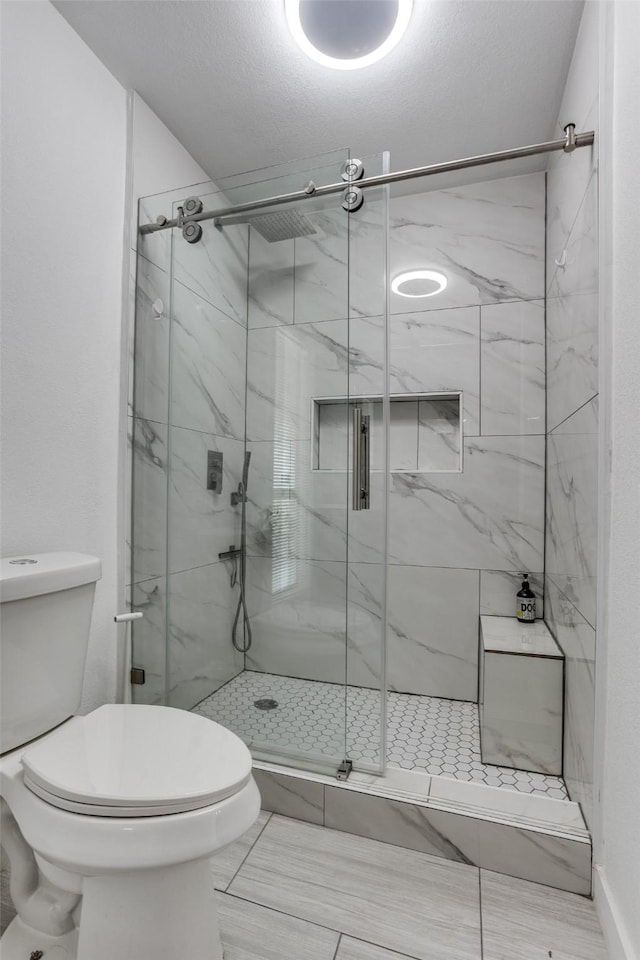1321 Glyndon Dr, Plano, TX 75023 - full bathroom featuring toilet and a marble finish shower