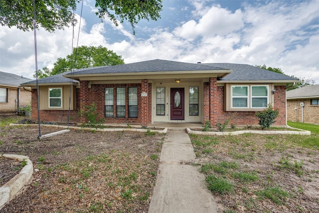 1321 Glyndon Dr, Plano, TX 75023 - view of front of house featuring brick siding, roof with shingles, and covered porch
