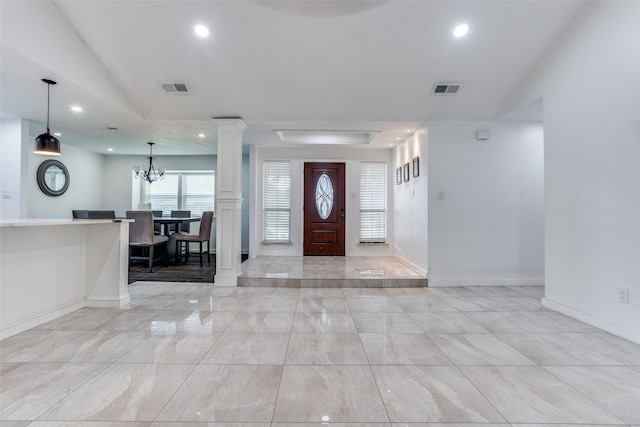 1321 Glyndon Dr, Plano, TX 75023 - foyer featuring ornate columns, recessed lighting, baseboards, a chandelier, and light marble finish floors
