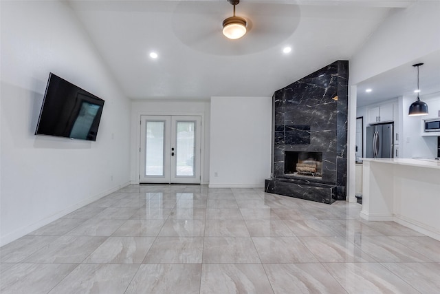 1321 Glyndon Dr, Plano, TX 75023 - unfurnished living room featuring lofted ceiling, light marble finish flooring, recessed lighting, a high end fireplace, and ceiling fan