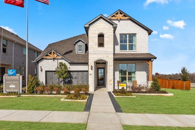 9309 Derry, Aubrey, TX 76227 - view of front of house featuring brick siding, stone siding, and roof with shingles