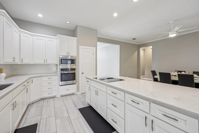 4616 Heatherbrook Ln, Grand Prairie, TX 75052 - kitchen with stainless steel appliances, decorative backsplash, white cabinetry, light stone counters, and recessed lighting