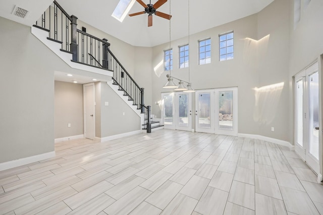 4616 Heatherbrook Ln, Grand Prairie, TX 75052 - unfurnished living room featuring a ceiling fan, a high ceiling, french doors, stairway, and baseboards