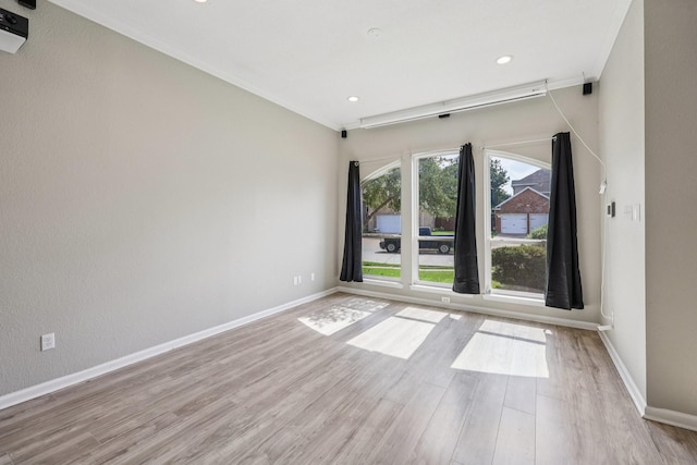 4616 Heatherbrook Ln, Grand Prairie, TX 75052 - spare room with light wood-style flooring, baseboards, ornamental molding, and recessed lighting