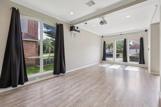 4616 Heatherbrook Ln, Grand Prairie, TX 75052 - empty room with crown molding, plenty of natural light, baseboards, wood finished floors, and recessed lighting