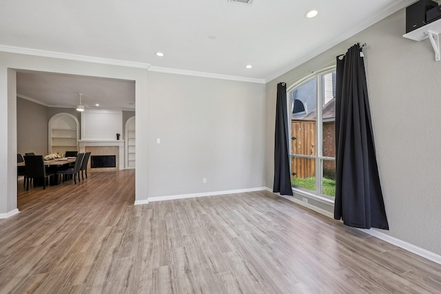 4616 Heatherbrook Ln, Grand Prairie, TX 75052 - empty room featuring wood finished floors, built in features, baseboards, recessed lighting, and ornamental molding