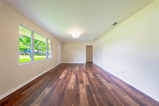 522 E Kempner St, Mabank, TX 75147 - empty room featuring baseboards and dark wood-style floors