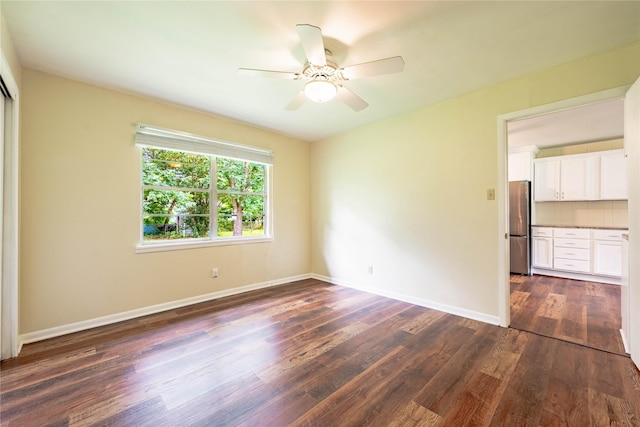 522 E Kempner St, Mabank, TX 75147 - unfurnished room featuring dark wood-style floors, a ceiling fan, and baseboards