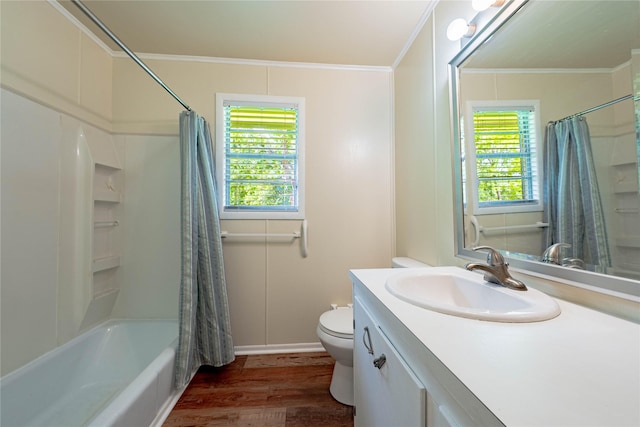 522 E Kempner St, Mabank, TX 75147 - bathroom with plenty of natural light, vanity, toilet, wood finished floors, and crown molding
