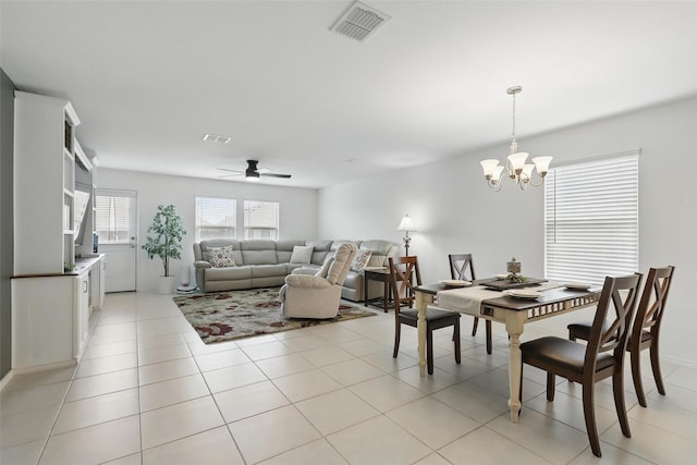 8329 Grand Oak Rd, Fort Worth, TX 76123 - dining room with ceiling fan, a chandelier, and light tile patterned floors