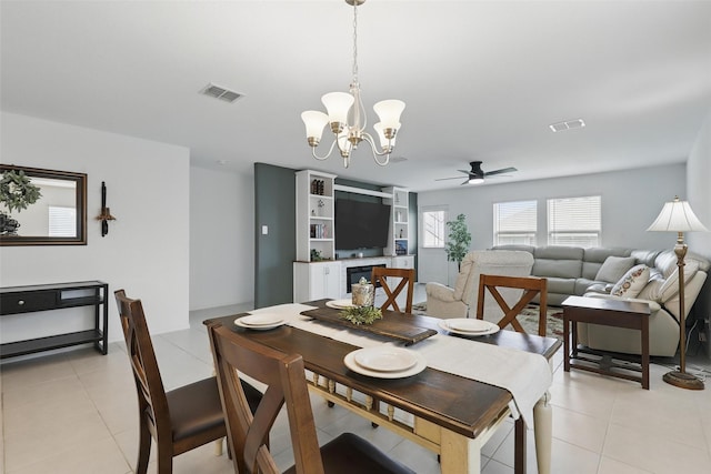 8329 Grand Oak Rd, Fort Worth, TX 76123 - dining room with a chandelier, a ceiling fan, and light tile patterned floors